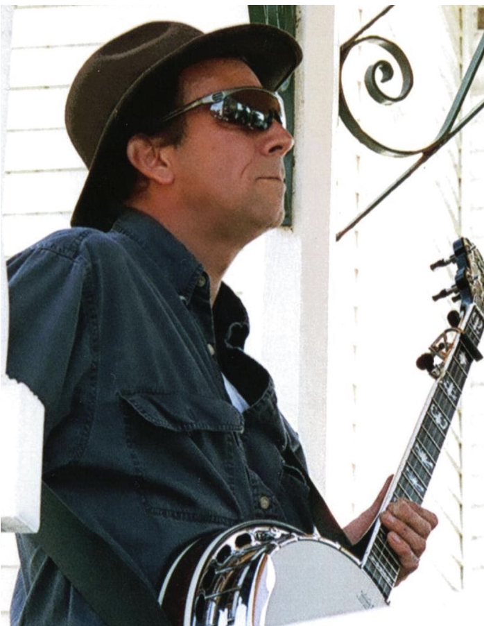 Matt playing his five-string resonator banjo on a porch